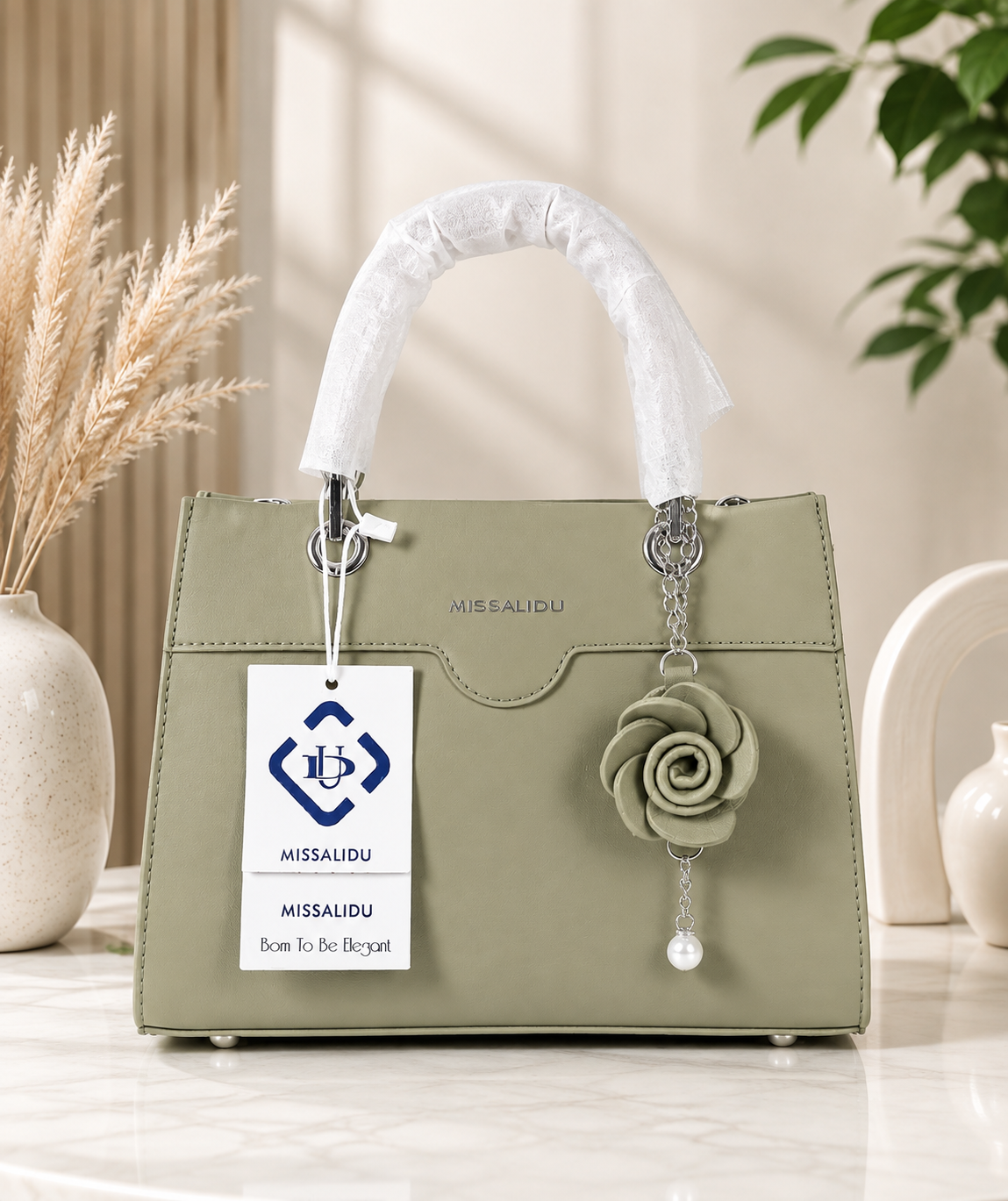 Elegant Structured Handbag with Floral Keychain