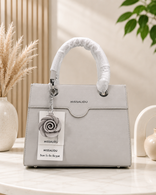 Elegant Structured Handbag with Floral Keychain