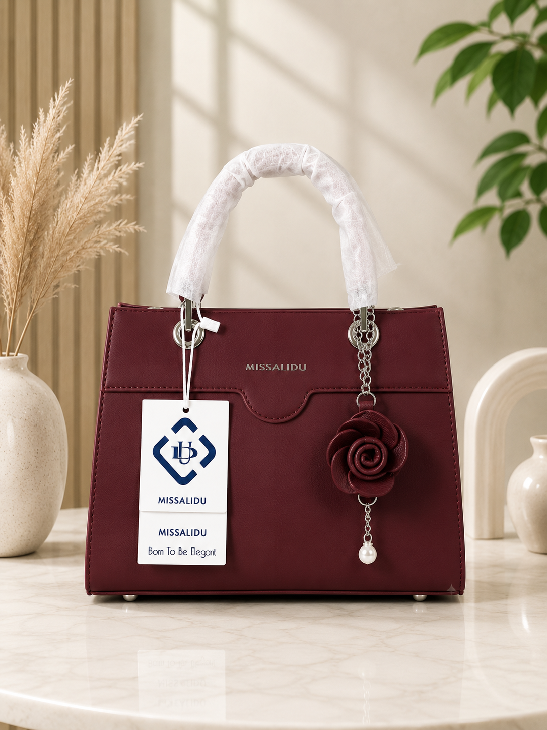 Elegant Structured Handbag with Floral Keychain