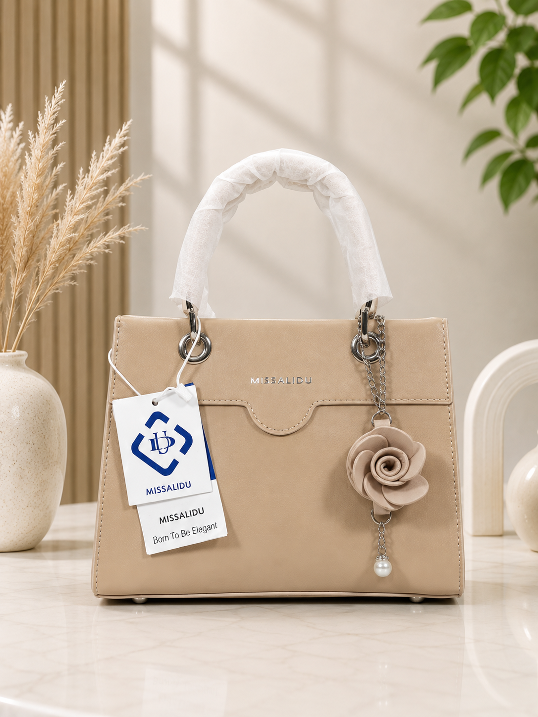 Elegant Structured Handbag with Floral Keychain